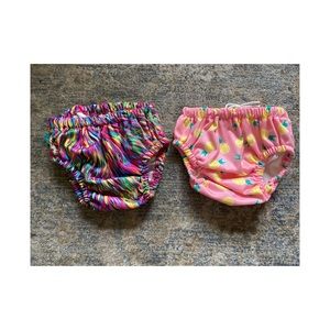 Pair of The Honest Co swim diapers